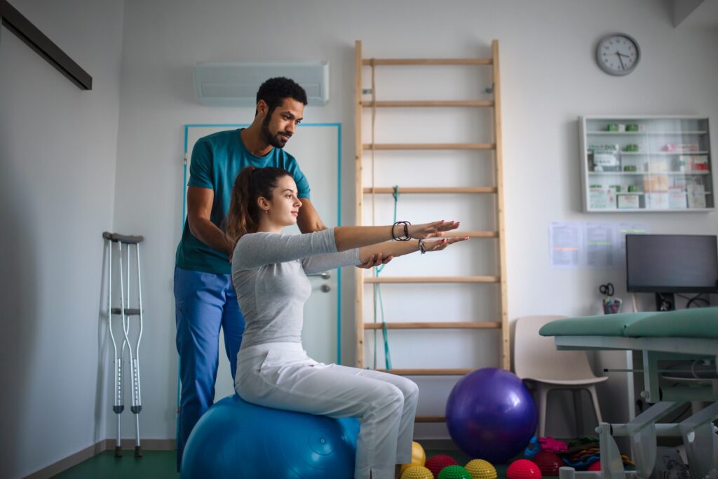 young male physiotherapist exercising with young w 2026 01 05 06 07 50 utc1